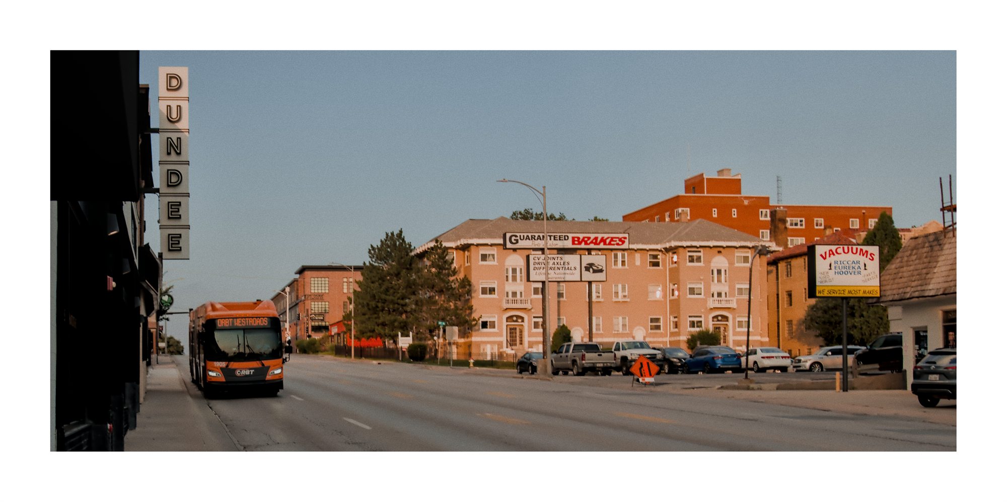 An Omaha street scene with theater signage and evening light.